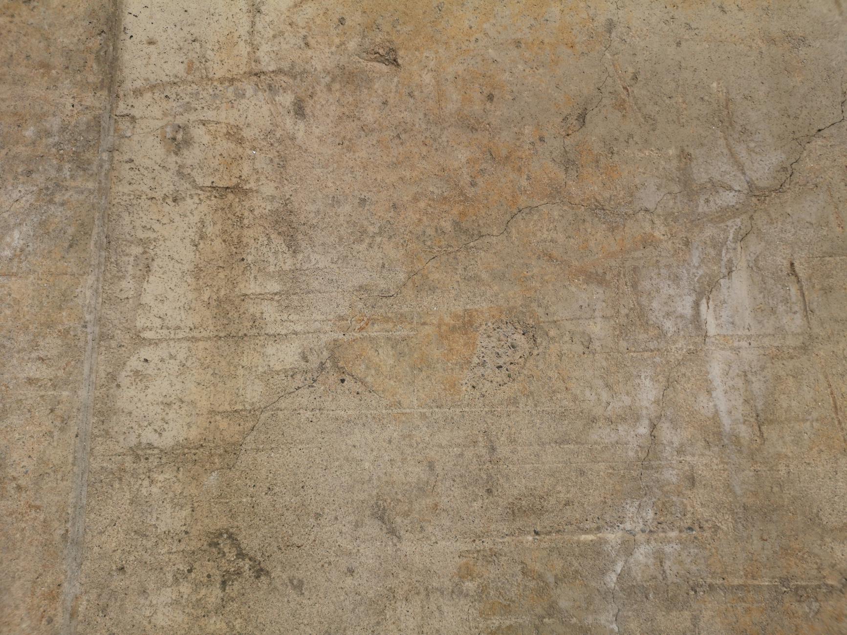 Zbliżenie chropowatej, postarzałej ściany z betonu